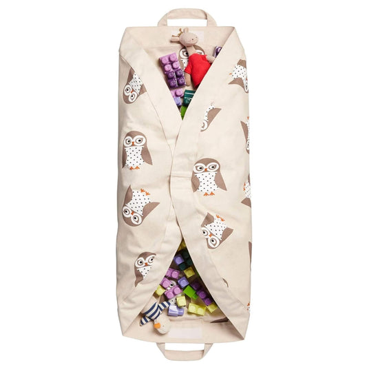 3 Sprouts Owl Play Mat transformed into toy storage bag, filled with blocks and soft toys. Drawstring sides folded inwards.