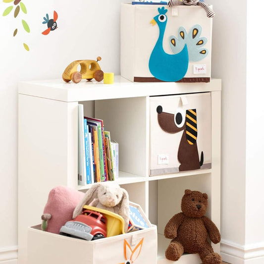Dog-themed 3 Sprouts storage box displayed in a white cubby unit alongside other animal boxes, books, and toys in a child's room.