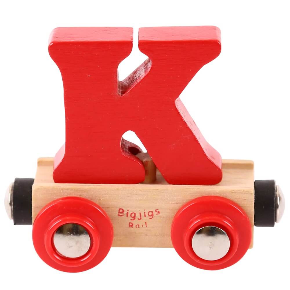 A red wooden toy train carriage with a brightly colored wooden letter 'K' inside, on a clear background.
