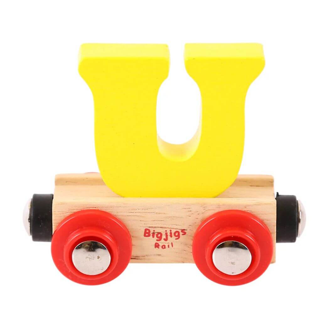 A wooden train carriage with a brightly coloured yellow 'U' shaped letter attached to it, branded with the Bigjigs Rail logo.