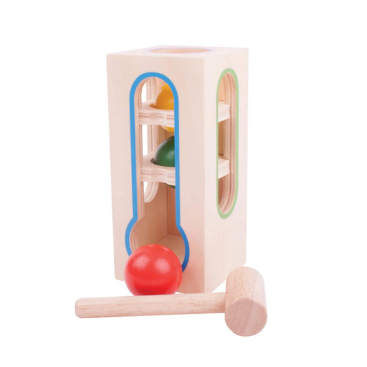 Side view of the wooden Ball Fall with vibrant balls ready for hammering fun.
