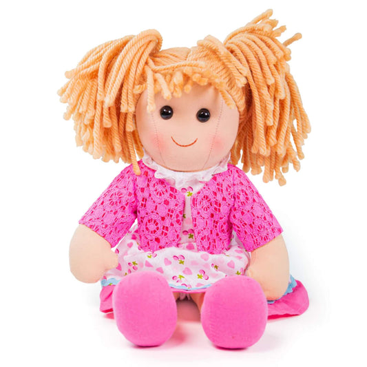Becky Doll sitting upright with her legs outstretched, showing her bright pink shoes and cheerful embroidered face.