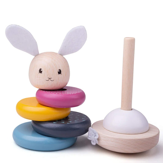 The wooden rabbit stacking toy shown with its rings removed and placed beside the bendy stacking pole for interactive play.