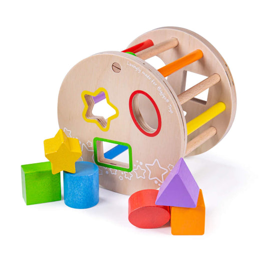 Wooden rolling shape sorter tipped on its side with chunky, brightly coloured shapes, including a star, circle, and square.