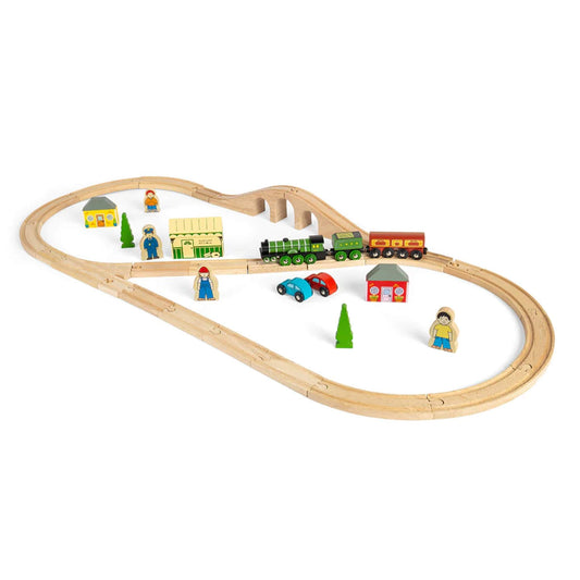 Angled view of the Bigjigs Flying Scotsman Set showing train crossing the bridge with station, cars, and accessories around the track.