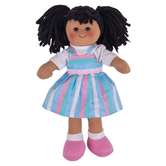 Closer view of the Kira doll with black yarn hair in bunches and a pastel dress featuring vertical stripes and pink ribbon detailing.