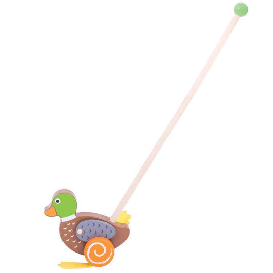 Side view of the Bigjigs Toys Push Along Duck showing the full length of the wooden pole with green handle and the duck’s colourful painted details.