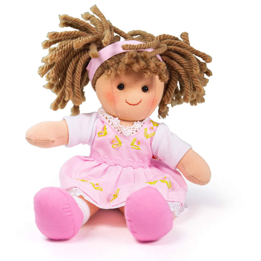 Close-up of Rose Doll sitting down, showing her pink dress with yellow embroidery and brown wool hair tied back with a headband.