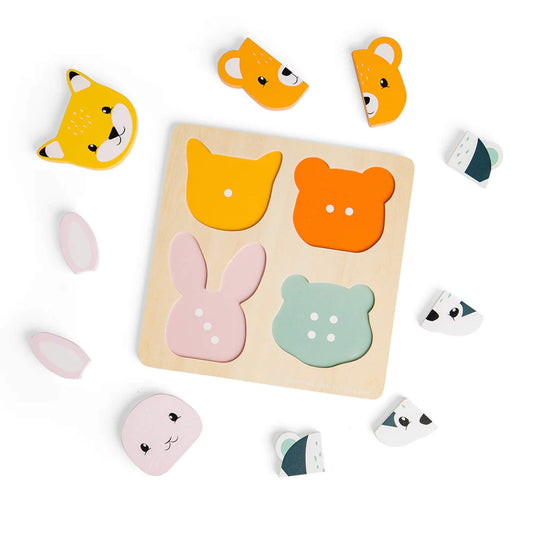 Woodland animal puzzle shown from above with all face pieces removed and scattered around the board, revealing shaped base slots with dot markers to support early counting.