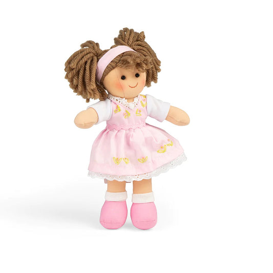  This soft and cuddly doll has a lacy pink dress and bunched brown hair that make her impossible to resist!