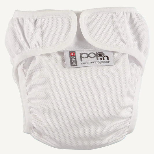 A white swim nappy liner displayed with its fastening tabs opened, showing the soft interior fabric and lightly textured outer surface. The leg openings are elasticated and gathered for comfort and containment.