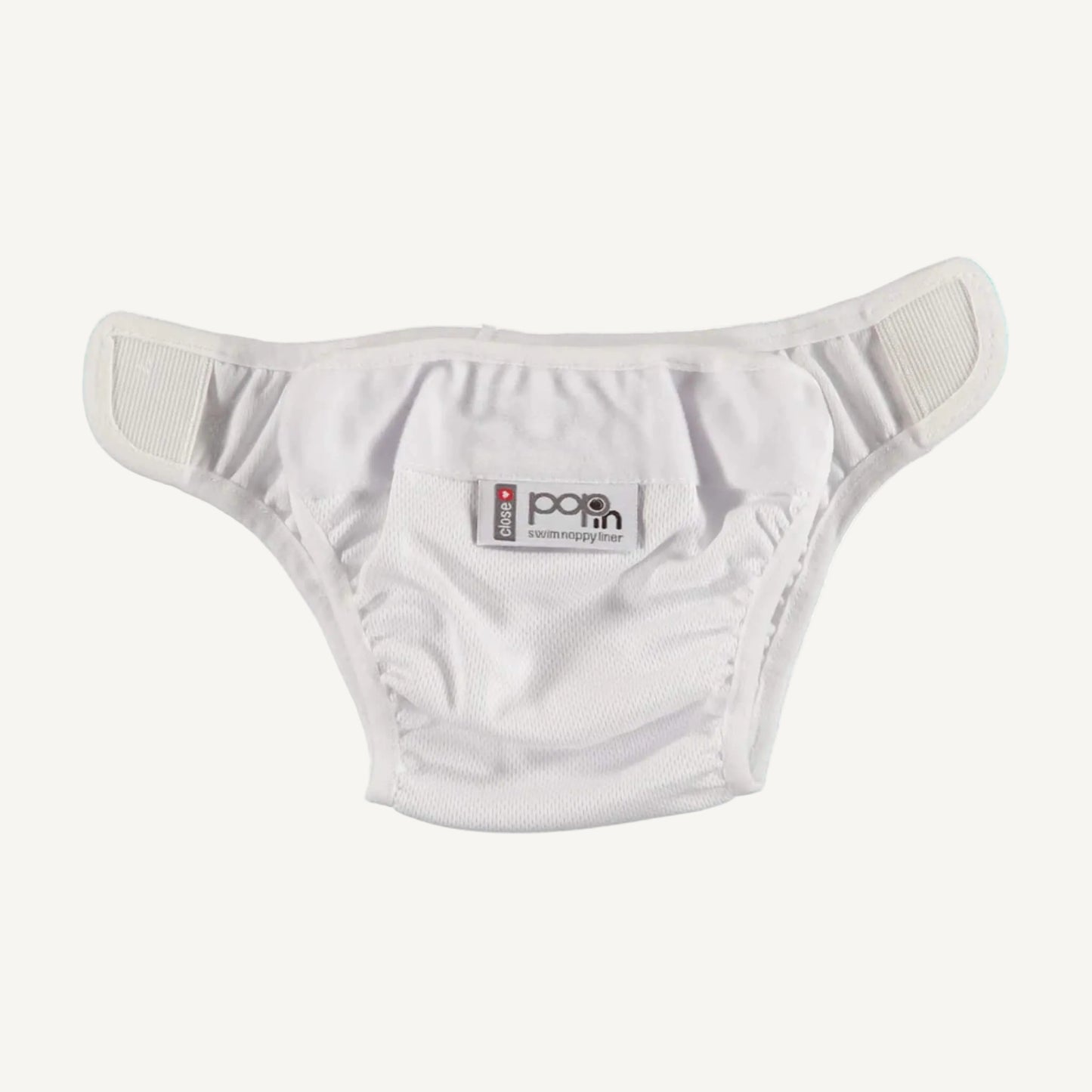 A white swim nappy liner arranged in a brief-style shape, showing the soft elastic around the legs and waistband, plus Velcro-style fastening tabs positioned at each side for easy adjustment.