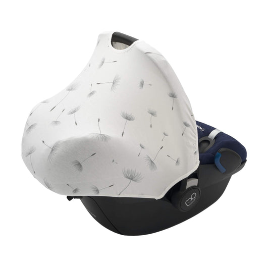 A dandelion print fabric car seat hoody fully extended over an infant car seat, covering the seat for shade and privacy.
