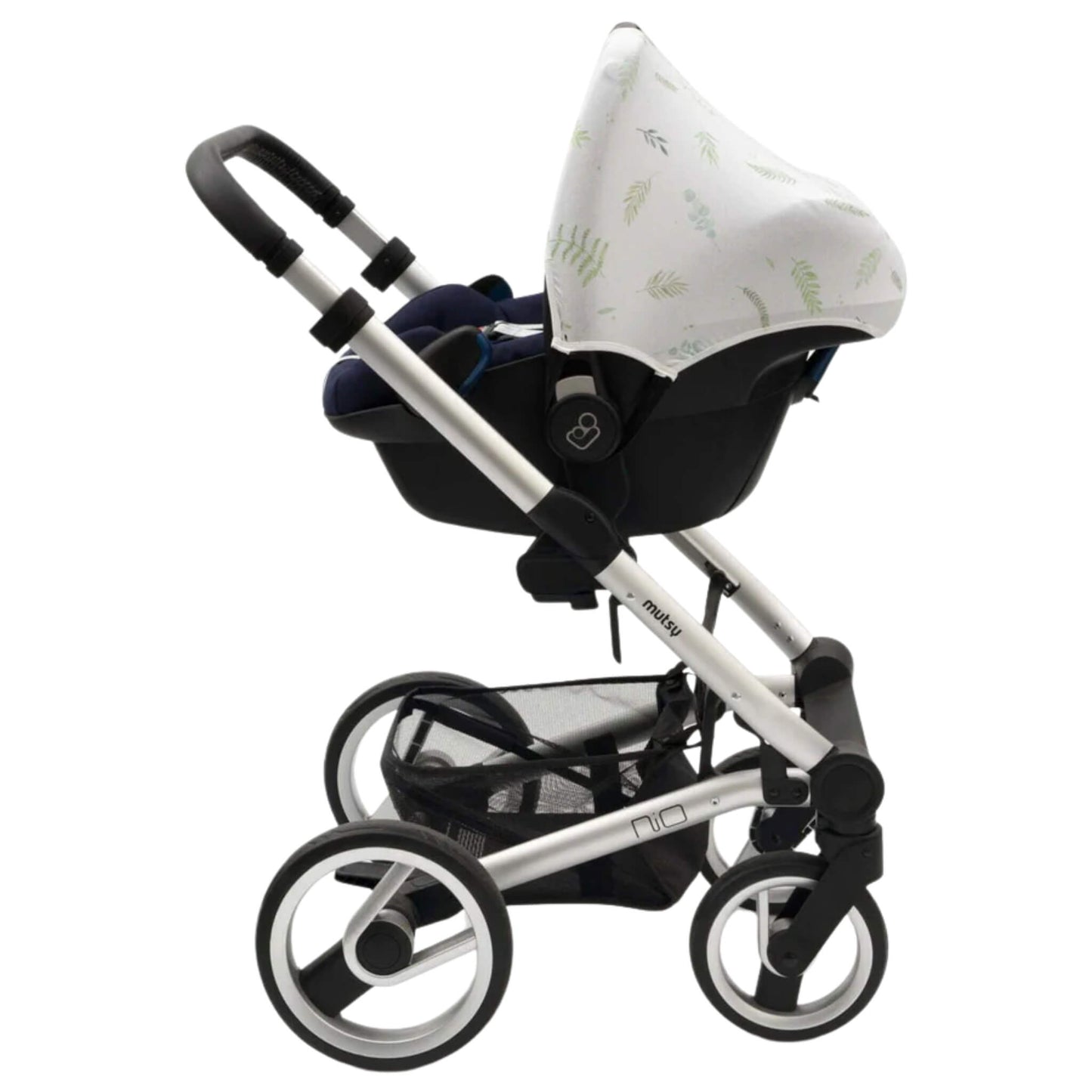 A white car seat hoody with green leafy design attached to an infant car seat placed on a silver pushchair frame, showing compatibility with a travel system.