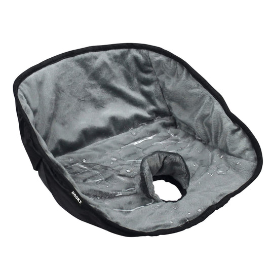 A grey plush car seat pad with water droplets on the surface, showing its water-resistant protection.