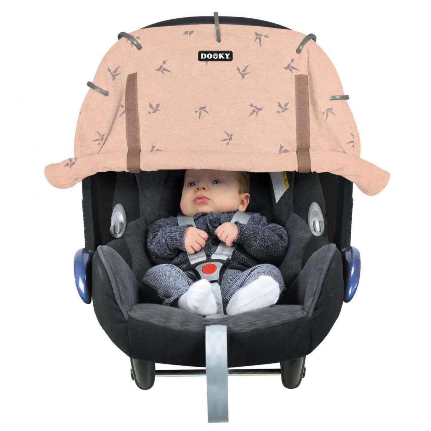 Dooky Sun Shade Origami Pink shown attached to a black infant car seat with a baby seated inside. The cover features a subtle origami bird print and is rolled down across the top.