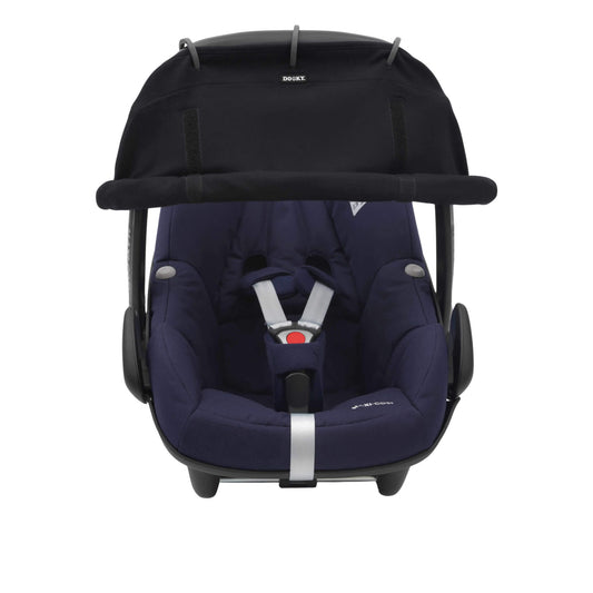 A black sunshade attached to an infant car seat. The shade is rolled down and fixed with Velcro, covering the upper portion of the seat.