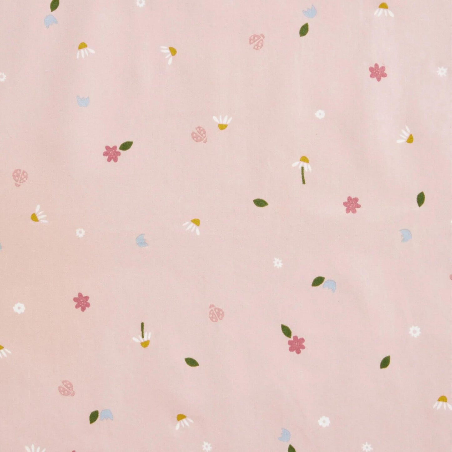 Close-up of the ErgoPouch Sleep Suit Bag fabric in Daisies print, featuring a delicate pattern of flowers, leaves, and ladybirds on a soft pink background.