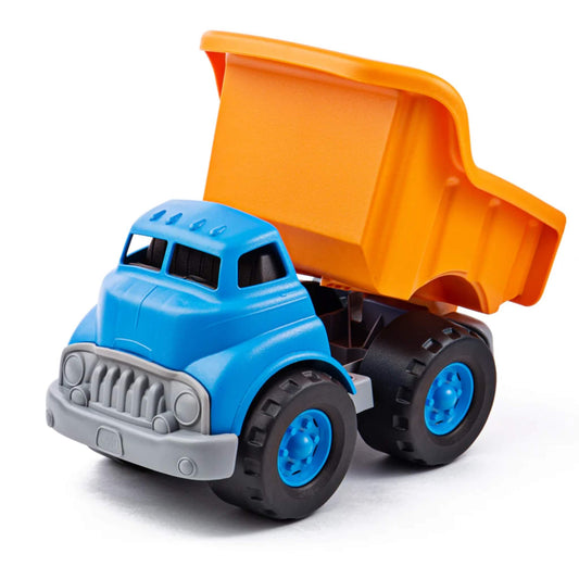 Side view of the dump truck with the orange bed raised, showing the tipping feature in action for loading and unloading play materials.
