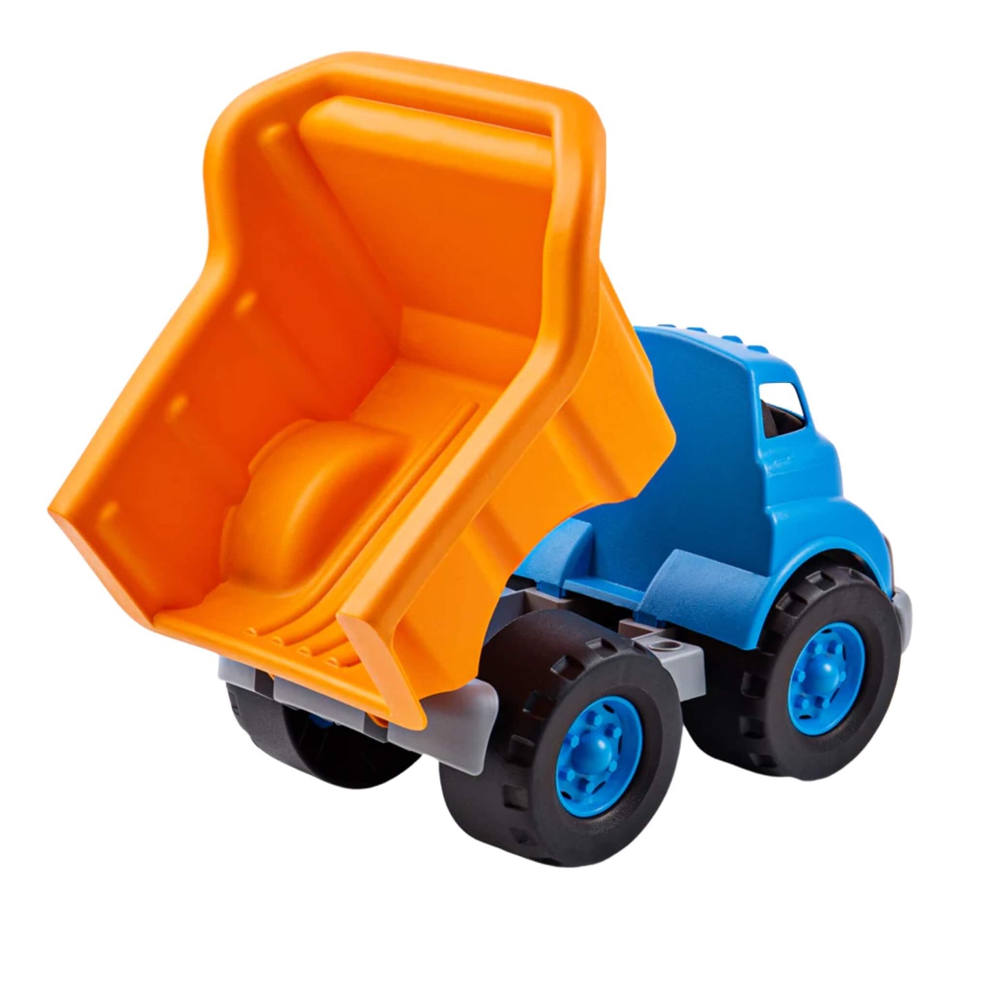 Rear view of the dump truck with the bed fully tipped, revealing the spacious interior and smooth design for easy dumping during play.