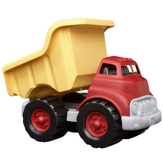 Side view of the red and yellow dump truck with the yellow dumper bed lifted, showing the tipping action and interior of the truck.
