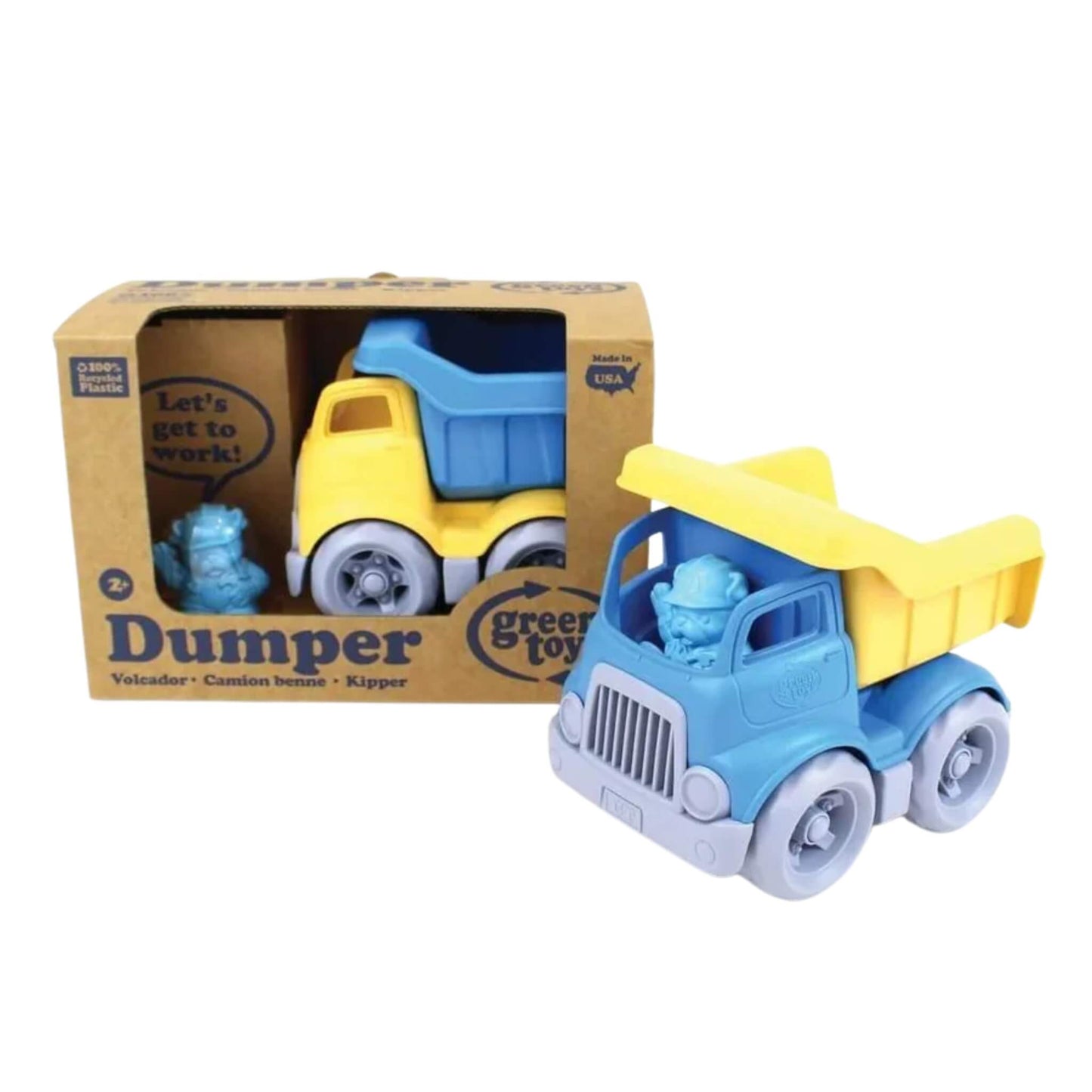 Green Toys Dumper Truck shown alongside its eco-friendly packaging, featuring the removable bulldog driver figure and a clear view of the truck’s yellow and blue design.