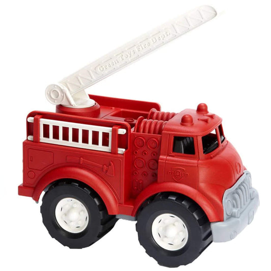 Side view of a red toy fire truck with the main white ladder extended upward at an angle, showing the rotation and vertical lift feature.