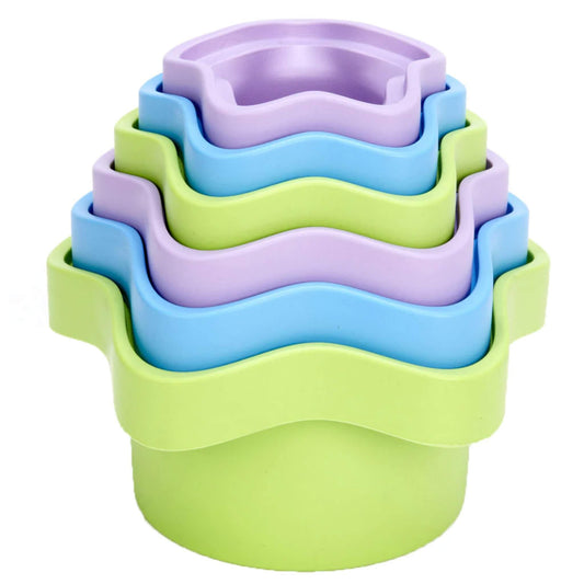 Toy stacking cups nested neatly inside one another, showing alternating colours and wavy edges.