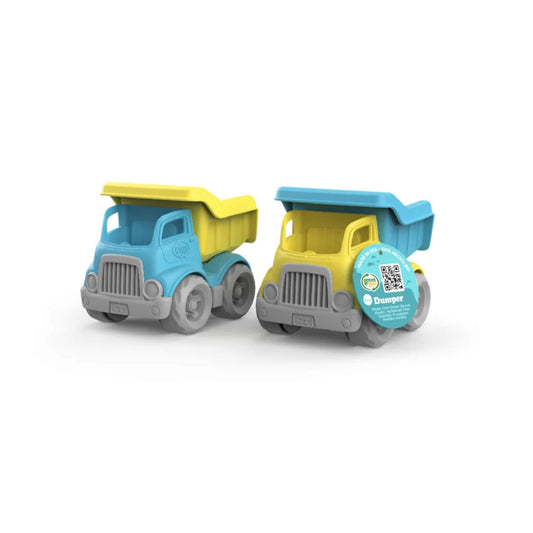 Two Green Toys OceanBound Dumpers side by side, one with a blue cab and yellow bed, the other with reversed colours and an attached swing tag.