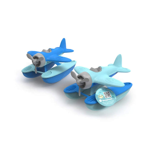 Two Green Toys OceanBound Seaplanes side by side in different blue colourways, each with floating pontoons and a spinning propeller, one with hang tag visible.