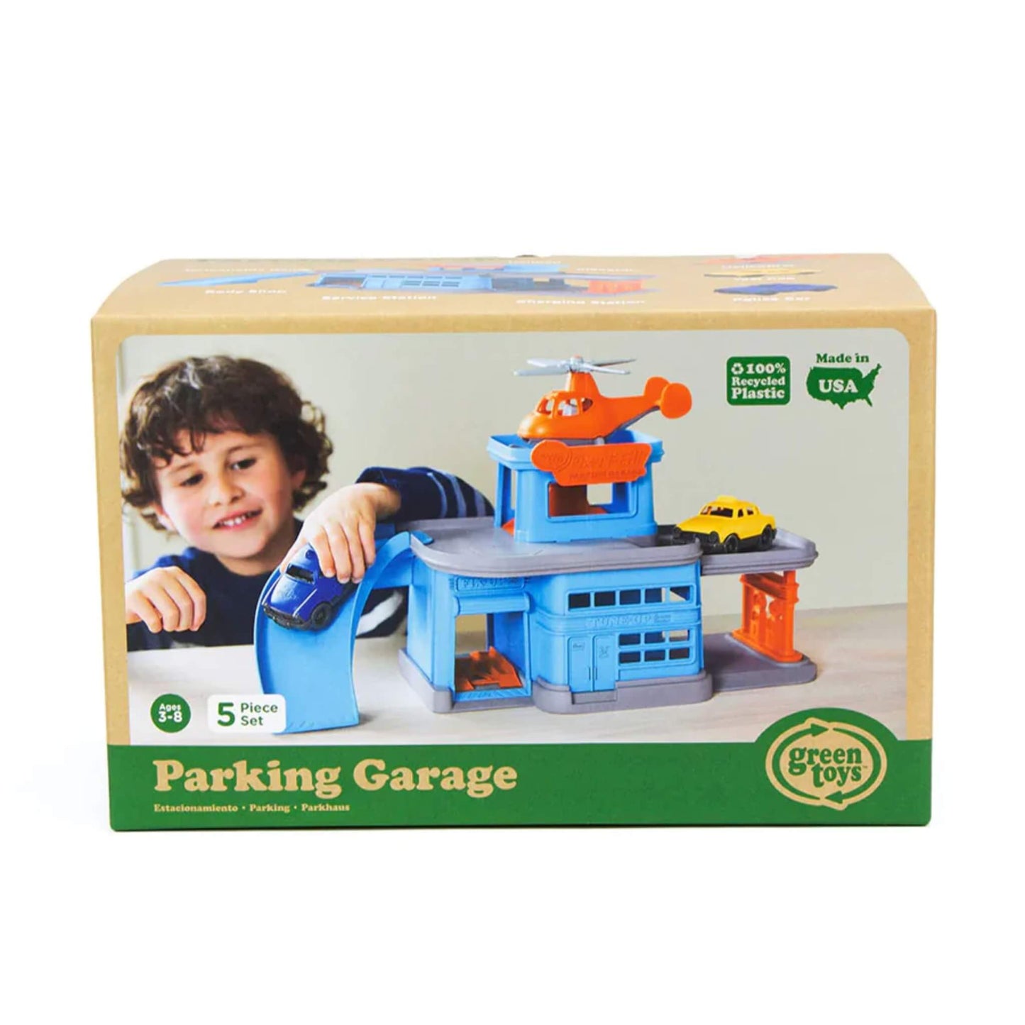 Green Toys Parking Garage packaging, showing the full playset with included helicopter and cars, recommended for ages 3 to 8.
