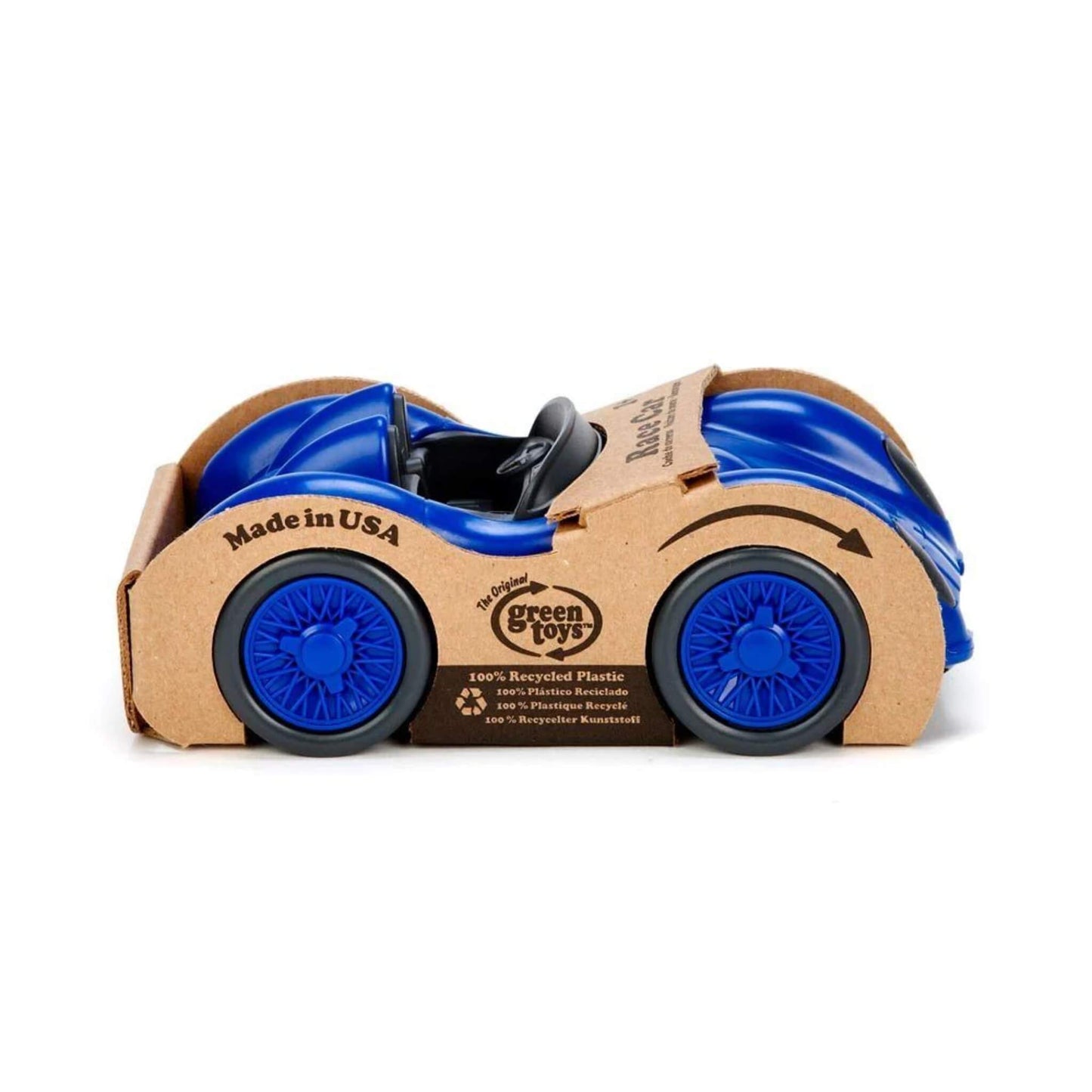 Side view of the blue Green Toys Racing Car inside its recyclable cardboard packaging, with printed branding and eco credentials visible.