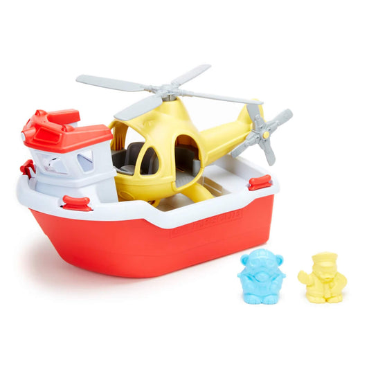 The yellow helicopter sits securely on the deck of the red and white rescue boat, with both crew figures—blue bear and yellow duck—displayed beside the set.