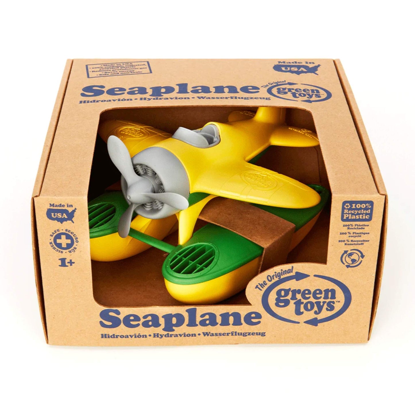 Green Toys Seaplane with yellow wings inside branded packaging, clearly displaying the product name, age suitability and sustainability details.