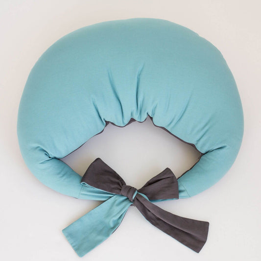 Feeding pillow in reef blue and charcoal, viewed from above showing waist tie detail.