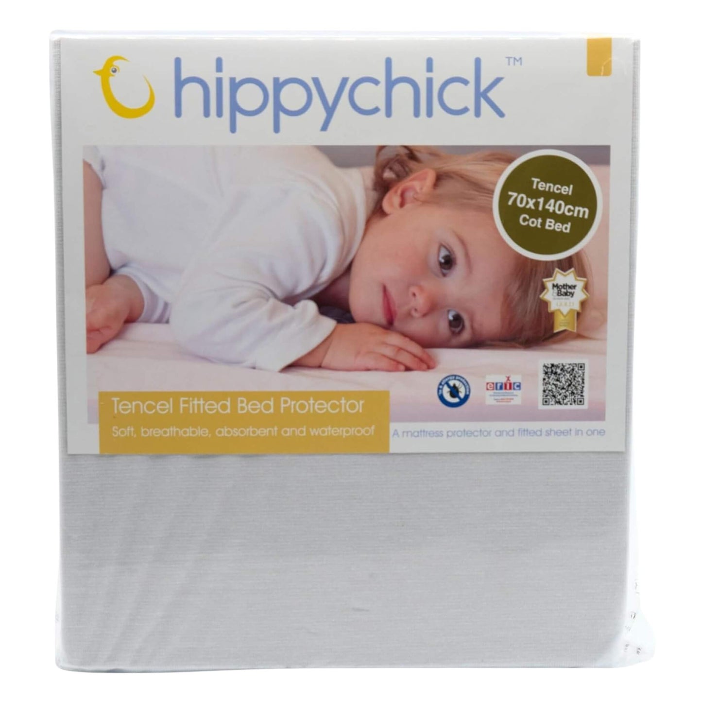 Retail packaging of the Hippychick Fitted Tencel Mattress Protector, showing a baby lying on the product with branding and size details printed on the box.