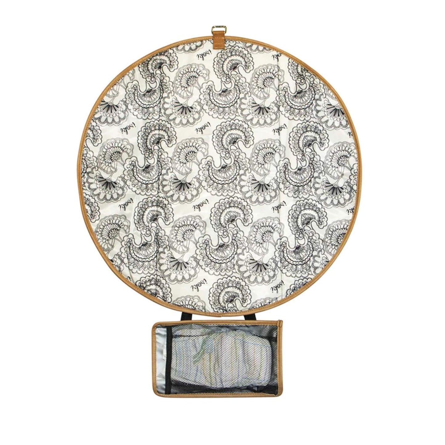 Open round change mat showing black and white patterned interior with tan edging and mesh pocket for nappies and wipes.