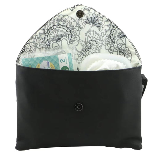 Open black change mat clutch lined with floral patterned fabric, containing nappies, wipes, and baby essentials neatly organised inside.
