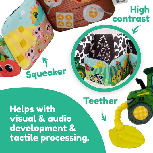 Close-up of a colourful baby sensory book showing playful farm animals, bold patterns, and a yellow tractor teether for tactile play.