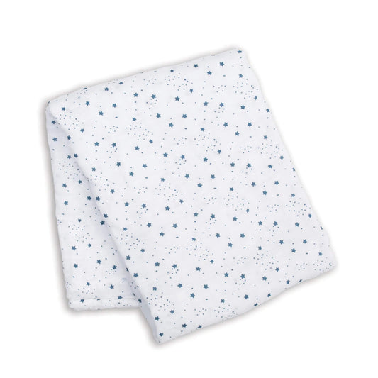 Folded cotton muslin swaddle showing a repeat pattern of small blue stars across the lightweight white fabric.