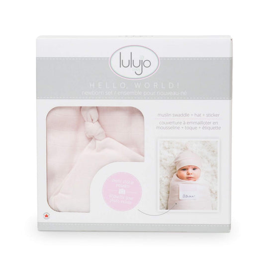 Lulujo Pink Hello World gift box showcasing the muslin swaddle, knotted hat and photo sticker with baby Athena featured in sample photo.