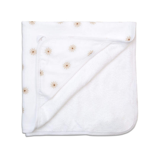 Lulujo folded towel displaying the white fabric with delicate beige/cream daisy pattern throughout.