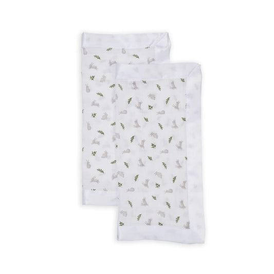 Pair of Lulujo security blankets with satin trim showcasing gentle grey bunnies and green foliage pattern on white muslin, perfect for baby comfort and soothing.