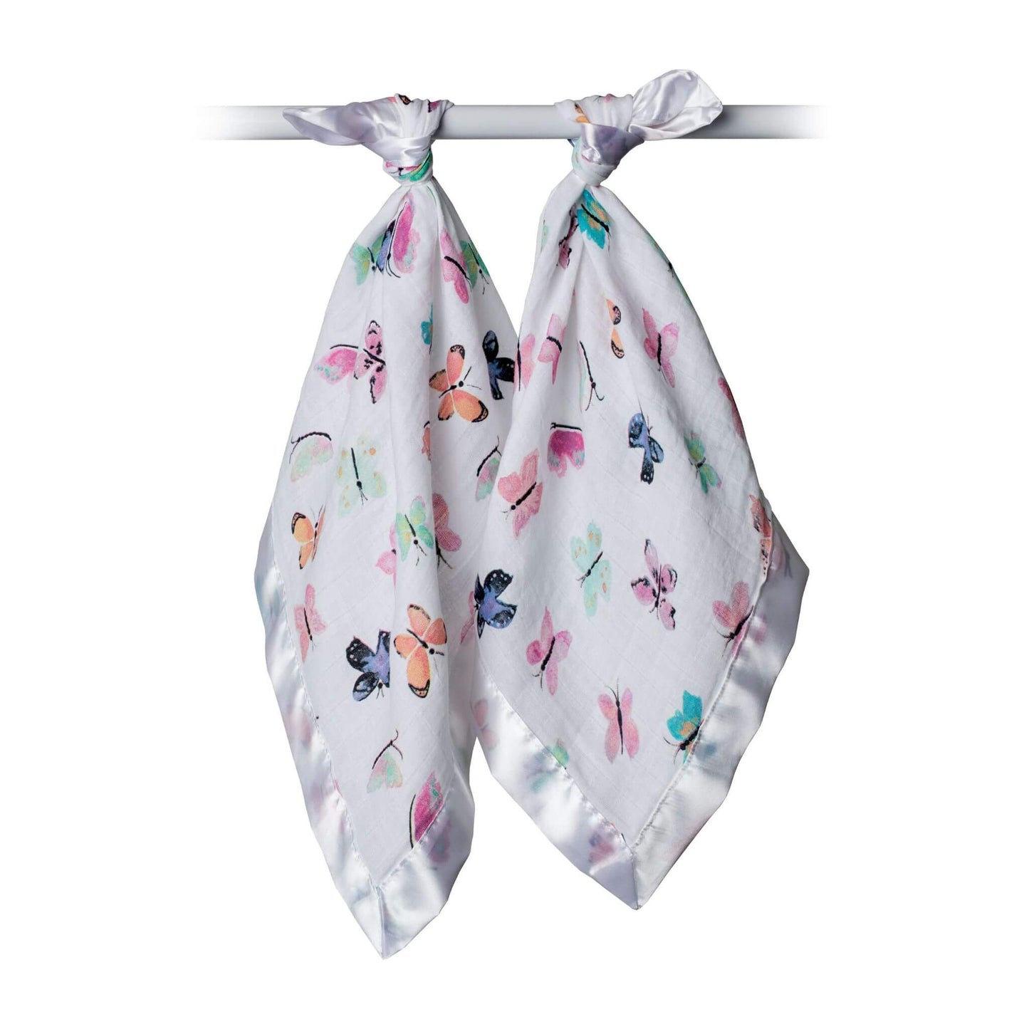 Lulujo Butterfly security blankets tied on nursery rod showing watercolour butterfly print in vibrant pastel colours on white fabric.