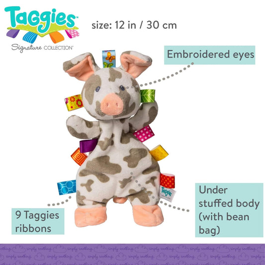A soft pig lovey toy measuring 12 inches, shown upright with embroidered eyes, peach snout and feet, brown patches on a cream body, and nine bright satin ribbon tags stitched along the sides. Text on the image highlights the embroidered details, understuffed bean bag body and ribbon count.