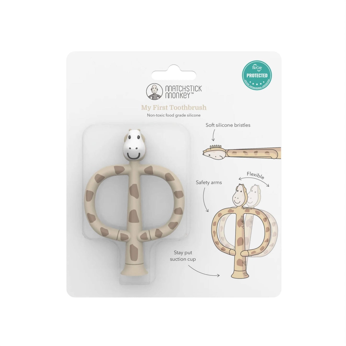 A giraffe-shaped silicone training toothbrush displayed inside clear plastic packaging on a printed card with illustrated features such as soft bristles and flexible safety arms.