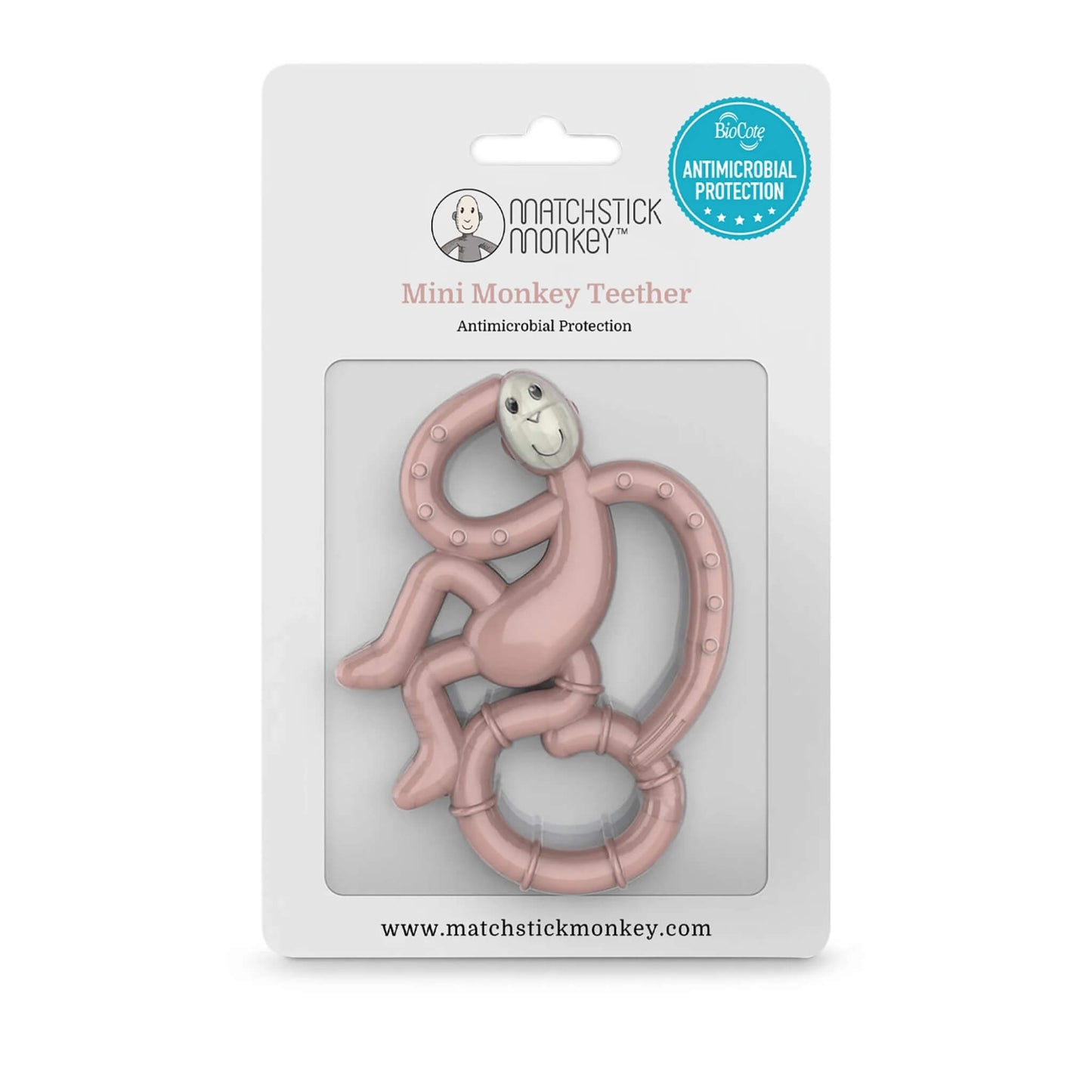Dusty pink monkey teether displayed in retail packaging with antimicrobial protection badge and product branding.