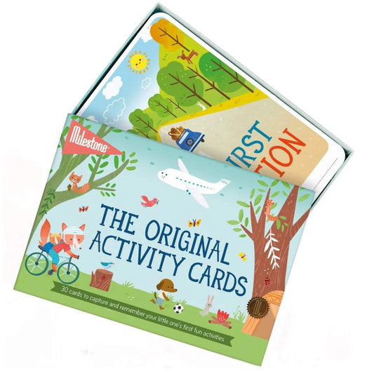 Open box of milestone Activity Cards with colourful cards peeking out, including designs for first family adventures.