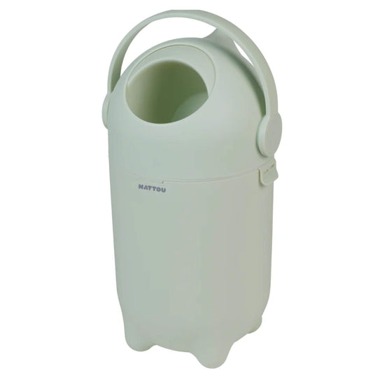 Side view of a green nappy Bin, showing its ergonomic handle and simple, modern design.