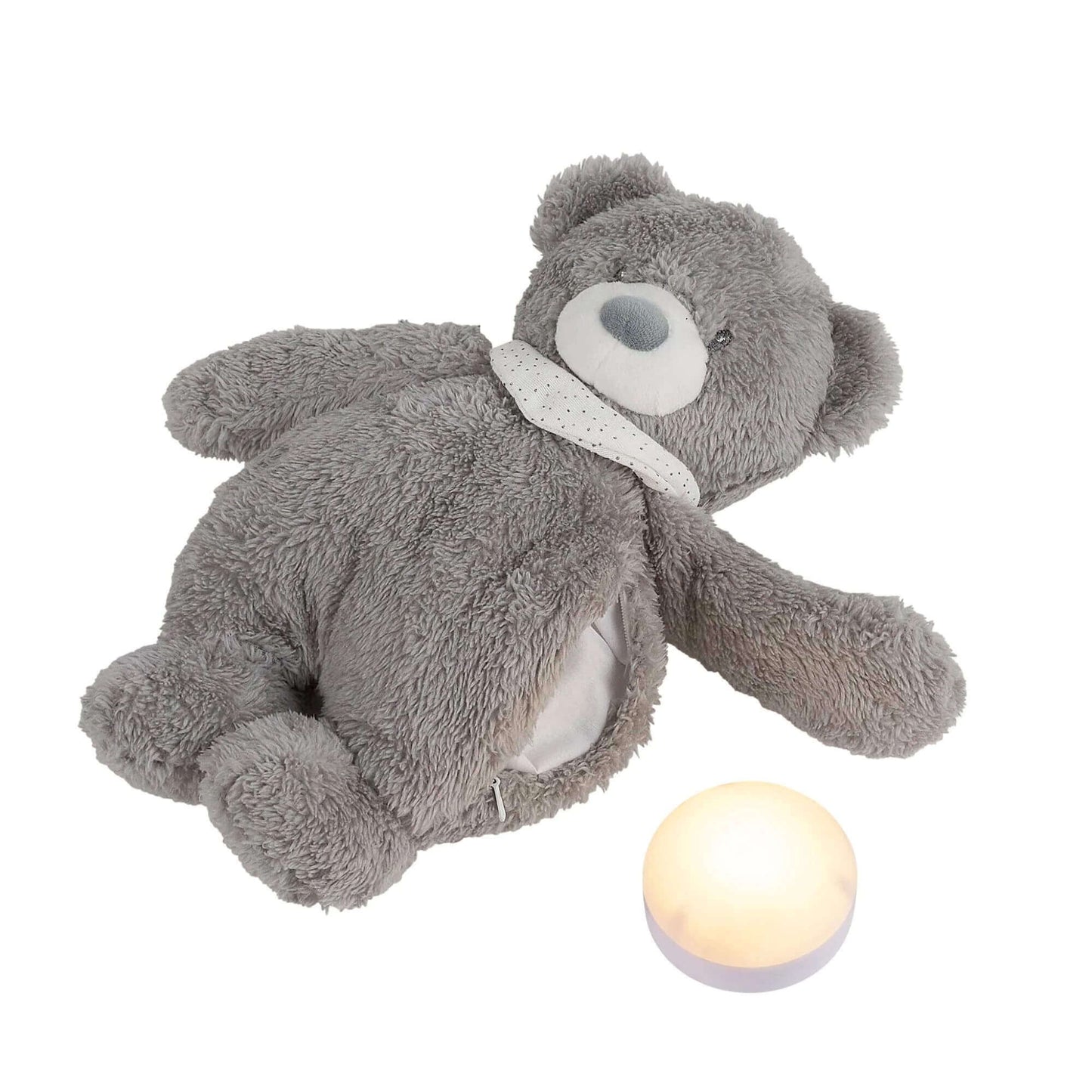 Grey plush bear nightlight with soft fur, shown lying down next to a glowing round nightlight.